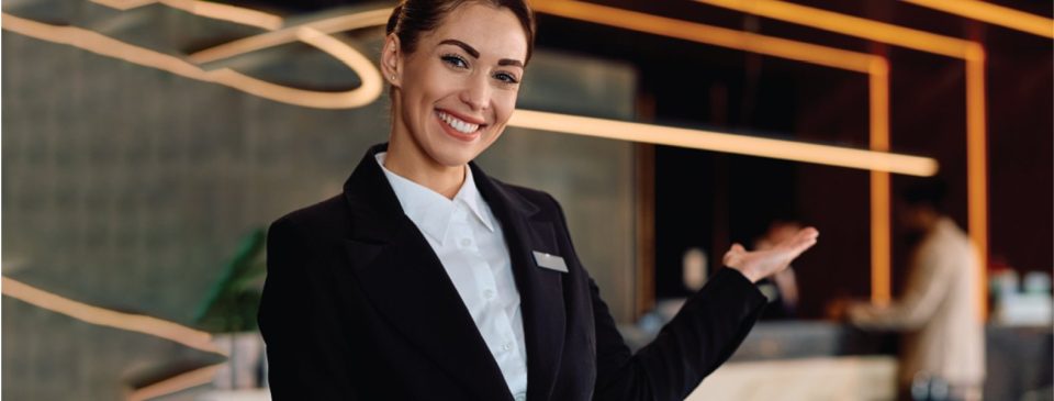 Smiling hotel concierge woman