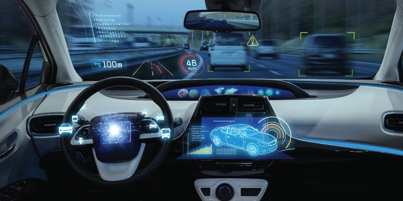 A futuristic car interior featuring a digital dashboard with augmented reality (AR) displays. The steering wheel is surrounded by holographic icons indicating vehicle diagnostics, speed (48 mph), and distance to objects ahead (100m). A central touchscreen showcases a detailed 3D car model with interactive data overlays. The windshield projects AR elements, including road alerts and navigation guidance, against the blurred backdrop of a highway. This image illustrates advanced autonomous driving technology and innovative automotive interfaces.
