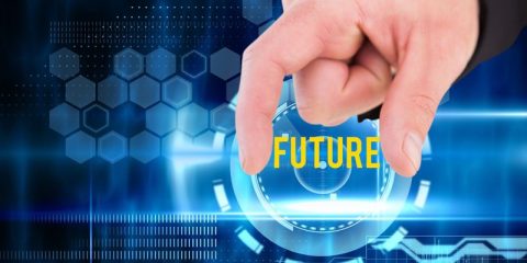 A close-up of a hand pinching an abstract futuristic interface, with the word "FUTURE" prominently displayed in bold yellow letters. The background features hexagonal patterns, glowing blue elements, and a digital design evoking technology and innovation. The visual suggests the concept of interacting with or shaping the future through technology.