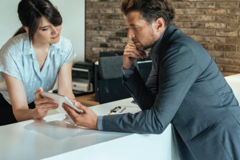 A Receptionist helping a customer on their phone