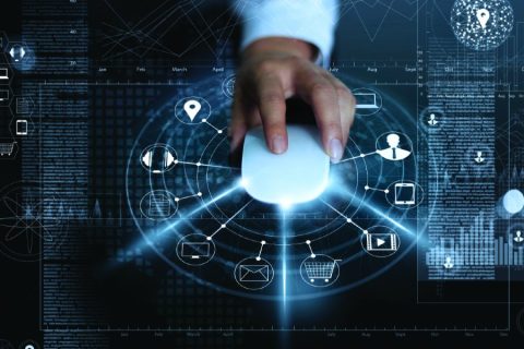 Futuristic image of a man's hand on a mouse.