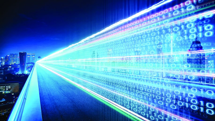 A futuristic cityscape at night with a vibrant highway of glowing binary code streams (1s and 0s) extending into the distance, symbolizing high-speed data transmission. The illuminated skyline features modern skyscrapers in cool blue tones, blending with the dynamic motion of digital lines, emphasizing the theme of advanced technology and connectivity.