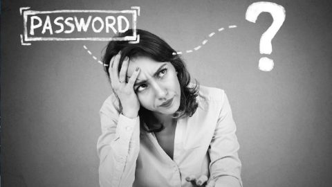 Black and white photo of a woman contemplating her password security.